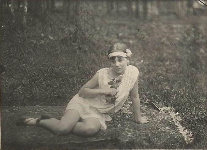 Woman with flowers, 1920s